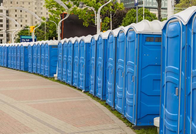 hygienic portable restrooms lined up at a music festival, providing comfort and convenience for attendees in Cape Canaveral FL